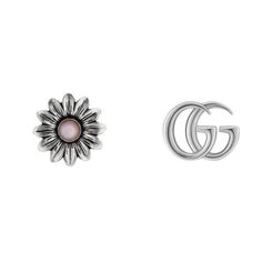 From Gucci, the natural beauty of the botanic world continues to act as a rich source of inspiration for their designs. Crafting from precious sterling silver, one of these petite studs is interpreted as the Double G and the other as a delicate flower with mother of pearl center. 925 sterling silver with aged finish Double G on one earring Flower with pink mother of pearl on one earring 1 pearl, totaling approximately 0.25 carats 12.7mm in diameter Gucci Earrings, Fall Rings, Gucci Jewelry, Floral Studs, Mother Of Pearl Earrings, Gucci Gg Marmont, Flower Stud Earrings, Earrings Flower, Gg Marmont