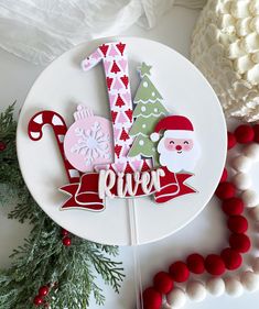 a white plate topped with lots of christmas decorations