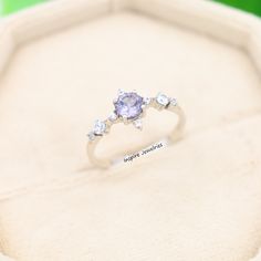 an engagement ring with three stones in it