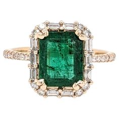 This statement ring has a vintage style Emerald surrounded by natural earth mined round and baguette diamond accents. This ring is made with solid 14k yellow gold and can be customized to fit your needs! This ring also makes a beautiful May birthstone ring for your loved ones! Specifications: Item Type: Ring Centre Stone: Emerald Treatment: Oiled Weight: 1.96ct Head size: 9x7mm Shape: Emerald cut Hardness: 7.5 - 8 Metal: 14k/2.66g Diamond Clarity/Color: SI / G-H Diamond Count/Weight: 36/0.50 cttw Sku: AJR252/4070 This ring is made with solid 14K Gold and natural Earth mined SI / G-H diamonds. As listed, this ring is ready to ship. If you're interested in purchasing this setting with a different center stone please message us! May Birthstone Rings, Natural Earth, Baguette Diamond, Emerald Ring, Birthstone Ring, Diamond Clarity, Cocktail Rings, Emerald Cut, Statement Ring