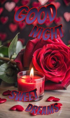 a red rose sitting next to a candle with the words good night sweet dreams on it