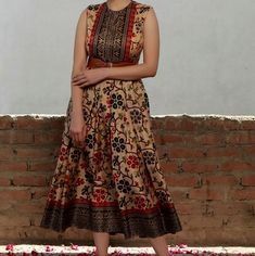 A Joyous, Fluid Cotton Silk Dress That's Perfect For The Summer Months. Size 36-34-38 Traditional Floral Print Midi Dress, Beige Floral Print Dress For Festive Occasions, Traditional Beige Dresses With Printed Motifs, Sleeveless Anarkali Dress With Printed Motifs, Fitted Brown Anarkali Dress, V-neck Kalamkari Print Dresses For Festive Occasions, Festive V-neck Kalamkari Print Dresses, Festive Kalamkari Print V-neck Dresses, Pleated Long Dress