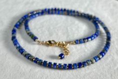 "💎 DE T A I L S * Handmade in Canada * Genuine Lapis Lazuli heishi gemstones (6mm) * 24k gold plated Miyuki glass beads * Adjustable Length: 18\" plus 2\" gold filled chain extender * 14 gold filled accent beads (3mm) * 18 gold filled lobster clasp  * Gemstones are 100% genuine 💎    LAPIS LAZULI A stone of wisdom, intuition, and truth, Lapis Lazuli is a powerful crystal for anyone seeking to deepen their connection to self. It encourages self-awareness, allows self-expression and reveals inner truth.  This stone stimulates clarity and   creativity. It releases stress and bring deep inner peace. Lapis Lazuli inspires confidence, bonds relationships, and aids in expression of feelings and emotions." Lapis Lazuli Gemstone Beads For Jewelry Making, Gift Lapis Lazuli Beaded Necklaces With Round Beads, Lapis Lazuli Beaded Necklaces As Gift, Gift Lapis Lazuli Beaded Necklace With Round Beads, Gift Natural Stone Lapis Lazuli Beads, Lapis Lazuli Beaded Necklace With Faceted Beads For Gift, Gift Gemstone Beaded Necklaces With Heishi Beads, Gift Gemstone Heishi Beads Necklace, Gift Gemstone And Heishi Beads Necklace