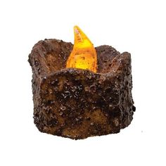 a candle that is made out of dirt