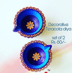 two decorative teapots sitting next to each other on a white surface with the words decorative teapot diya set of 2 rs 80 - 707