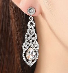 "Water-Drop Crystal Drop Long Earrings Silver Elegant Bridal Wedding Gauges Plugs 6g 4g 2g 4mm 5mm 6mm FOR GAUGES/STRETCHED EARLOBES: All styles come with internally threaded (screw on/off) double flare tunnels. You also have the option to add an o-ring (for $1) that can be worn with the screw on/off flares for extra security that can help with possible sagging, or by themselves without the screw on/off flares making it a single flare. REGULAR POSTS/EARRINGS (not gauges for stretched earlobes): Long Earrings Silver, Long Bridal Earrings, Silver Bridal Earrings, Silver Head Piece, Flower Girl Bracelets, Long Silver Earrings, Starburst Earrings, Gold Bridal Earrings, Crystal Dangle Earrings