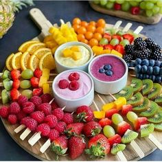 various fruits and dips arranged on a platter