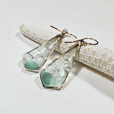 "Made to order. Please see my policies page or my shop announcement for current production times on made to order items. A collection of teal, aqua, and white sea glass pieces have been thoughtfully displayed upon a sea of clear resin. It has a lovely stained glass effect, especially when held up to the light. All of the sea glass has been gathered from beaches across the Hawaiian islands. The first five pictures are in rose gold filled, the next three are in sterling silver, and the last two ar Stained Glass Effect, White Sea Glass, Glass Effect, Tourmaline Earrings, Sea Glass Earrings, White Sea, Earrings Geometric, Glass Pieces, Hawaiian Islands