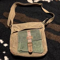 Cargoit Brand. Canvas Crossbody Bag. Heavy Duty Utility Bag. Adjustable Shoulder Strap. 6 Compartments Total With Magnetic Closure And Zippered Compartments On The Outside And Pockets And Zippered Compartment On The Inside. Distressed Vintage Waxed Medium Size. Unisex. Would Be Great For Camping Or Traveling As It Is Water Repellent. Like New Condition- Never Used But The Tags Were Taken Off. Utility Bag, Leather Travel Bag, Canvas Crossbody Bag, Leather Travel, Magnetic Closure, Green And Brown, Travel Bag, Repellent, Water Repellent