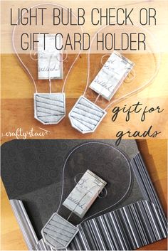 the light bulb check or gift card holder is made out of cardboard and wire, along with