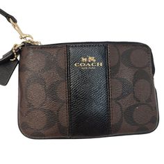 Coach Signature Brown And Black Two Tone Wristlet Wallet Clutch. Signature Coated Canvas And Smooth Leather Two Credit Card Slots Zip Closure Wrist Strap Attached 7 3/4" (L) X 4 3/4" (H) X 1/2" (W) Brand - Coach Color - Brown, Black Features - Wristlet, Zips Around, Zipper, Card Card Slots, Leather, Signature Logo Gender - Female Material - Leather Condition - New Without Tags Ships Same Or Next Day! Offers Welcomed! Big Bundle Discounts! Brown Crossbody Wallet For On-the-go, Brown Pouch Wristlet For On-the-go, On-the-go Brown Crossbody Wallet, Coach Rectangular Brown Coin Purse, Brown Rectangular Coach Coin Purse, Coach Brown Coin Purse For Everyday, Brown Wallet With Zipper Pouch For On-the-go, Brown Wallets With Zipper Pouch For On-the-go, Brown Rectangular Wristlet For On-the-go