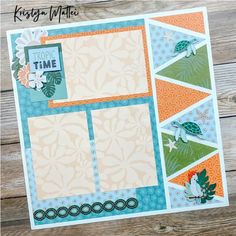 a scrapbook with an orange, blue and green cover on it sitting on top of a wooden table