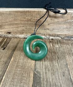 This very popular koru pendant is hand carved from Canadian Nephrite Jade, it measures approximately 41mm and comes with a fully adjustable cord. All of our Jade is 100% natural. The Koru symbolizes new life, growth, strength and peace. View other products from JademineCanada here: https://www.etsy.com/ca/shop/JadeMineCanada?ref=hdr_shop_menu ** All purchases from outside of Canada are subject to duties and VAT fee's ------ Jade West has been mining Canadian Nephrite Jade for 40 years.  Jade West is currently operating 4 mines in northern British Columbia, the most famous of which is our Polar Mine.  Polar Jade is the most famous Jade to be found in Canada it is harder than all other nephrite - Jade West is the only company to mine Polar Jade at the Polar Mine. Our season spans roughly 2.5 Jade West, Fern Frond, Wooden Gift Boxes, Nephrite Jade, Jade Necklace, Natural Jade, Wooden Gifts, Jade Pendant, Coin Necklace