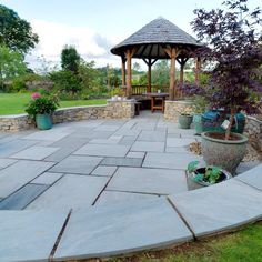 Natural Indian Sandstone Part of the charm of Kandla grey Indian sandstone is that each slab is coloured or patterned differently. When you bring them together in a patio or terrace they create a rich blend of colours, tones and patterns to make a beautiful overall paved tapestry. These slabs have been hewn and quarried from beds of natural sandstone and then cut by hand. Consequently, each stone also has a unique riven pattern in its finish and edge, so every stone has its own particular aesthetic - which is the underlying magic of the character of these natural stone products. Patio Paving Kandla Grey Sandstone is ideal for patios and garden paving - its natural colouration, stability and texture means it is perfect for outdoor living areas where the family can get together to enjoy the Sandstone Patio, Sandstone Paving Slabs, Patio Paving, Sandstone Pavers, Indian Sandstone, Sandstone Paving, Stone Patio, Garden Paving, Paving Slabs