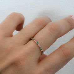 One of the biggest trends of the moment is rainbow, or multicolored jewelry! The colors are so vibrant, and truly matches with whatever you have on! Sweet, simple, and dainty eternity band. Perfect for a minimalist look, or for stacking. - - - D E T A I L S - - - * Made of 925 Sterling Silver * We use a THICK, DURABLE 14k Gold or Rhodium plating - for a piece that will last you years to come! * VERY HIGH QUALITY * Available in sizes 4, 5, 6, 7, 8, 9, or 10 * Features stones throughout the entire Multicolor Round Band Promise Ring, Multicolor Stackable Rings For Promise, Multicolor Open Stackable Rings For Promise, Multicolor Open Ring Stackable Rings As Gift, Multicolor Stackable Eternity Band As Gift, Multicolor Stackable Rings For Gifts, Multicolor Cubic Zirconia Rings For Gift, Multicolor Stackable Cubic Zirconia Jewelry, Multicolor Cubic Zirconia Stackable Rings