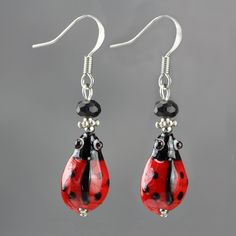 "The cute ladybug drop earrings are handmade using hand painted ceramic beads and crystal glass. Free US shipping. Customers who purchased this item said: \" So super cute and arrived in just a few days! Love this shop!!\" The Length of the earring is 3/4 inches, or 2.0 cm. (excluding the length of hook) ;-) My contact number: 626-379-1904. Please contact me if you would like to order multiples or customize a design for your special event, I will be pleased to give you a discount on a quantity o Hand-painted Czech Glass Jewelry Gift, Hand Painted Czech Glass Jewelry Gift, Hand Painted Czech Glass Jewelry For Gift, Czech Glass Earrings As A Gift, Hypoallergenic Czech Glass Earrings For Gift, Whimsical Red Hand Painted Jewelry, Cute Hand Painted Red Jewelry, Cute Red Hand-painted Jewelry, Cute Red Hand Painted Jewelry