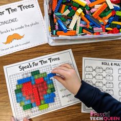 two children are playing with legos for the trees and break in the tree puzzles