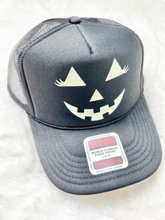 Halloween Themed Trucker Hat Jack-O-Latern Trucker Hat Get ready for spooky season with our Jack-O-Lantern Trucker Hat! This Halloween themed hat is perfect for any Halloween party or event. With its festive design and comfortable fit, it's sure to be a hit! Don't miss out on this must-have accessory for the season. Details Halloween themed black color glows in the dark Shipping - Our online store is based out of Palmetto, Florida, and packages typically ship within 2 - 4 business days after you Black Novelty Hat For Halloween, Halloween Costume Cap, Black Witchy Hat For Halloween, Novelty Halloween Costume Cap, Fun Halloween Costume Accessories Cap, Halloween Costume Party Cap, Spooky Hats For Halloween Costume Party, Adjustable Hats For Halloween Costume Party, Halloween Novelty Costume Accessories With Curved Brim