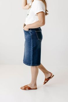 Every modest denim collection needs a classic no-fuss dark wash denim skirt! The 'Scout' denim skirt features a simple design, a modest knee-length, and working pockets for life on the go! The knit denim with belt loops ensures a flattering fit for a variety of body types. Style with a graphic tee and sneakers for an effortless vibe. Perfect for your everyday activities or traveling the world! Exclusively designed by us, for you! 85% Cotton 10% Polyester 5% Spandex Wash Cold Gentle Cycle Hang to Outfits Modest, Knit Denim, Denim Collection, Dark Wash Denim, Main Street, Skirt Outfits, For Life, Stretch Denim, Denim Skirt