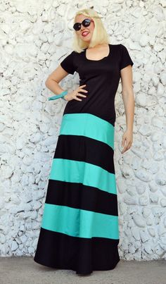 Striped maxi dress made of a perfect mix of jersey and pure cotton. The upper part of this cocktail dress is made of jersey, being very elastic and comfortable and the bottom part of the skirt is made of pure cotton, blending gorgeous the black and the turquoise. This funky party dress will for sure steal the spotlight this summer! Material: jersey - 50% cotton, 50% polyester skirt - 95% cotton, 5% elastane Care instructions: Wash at 30 degrees The model in the picture is size S. Can be made in Cotton Maxi Dress For Party, Spring Cotton Stretch Maxi Dress, Green Long Cotton Dress, Blue Cotton Maxi Dress, Fitted Cotton Maxi Dress, Fitted Cotton Maxi Dress In Casual Style, Casual Fitted Cotton Maxi Dress, Fitted Floor-length Cotton Maxi Dress, Black Long Cotton Dress