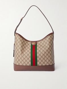 Thanks to its roomy, soft shape, Gucci's 'Ophidia' bag will easily fit a book, tablet and wallet with space to spare. It's made from hardwearing coated-canvas with brown leather and webbing trims. The strap can easily be adjusted to your preferred, most comfortable drop. Gucci Shoulder Bag With Leather Trim And Monogram Canvas, Gucci Canvas Shoulder Bag With Leather Trim, Gucci Monogram Canvas Shoulder Bag With Leather Trim, Gucci Brown Shoulder Bag With Leather Trim, Gucci Shoulder Bag With Gold-tone Hardware In Coated Canvas, Gucci Coated Canvas Shoulder Bag With Gold-tone Hardware, Gucci Leather Shoulder Bag With Leather Trim, Gucci Shoulder Bag With Leather Trim, Gucci Top Handle Shoulder Bag With Leather Trim