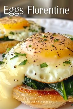 an egg and cheese sandwich is on a white plate with the words eggs florentine