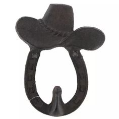 an iron hook with a cowboy hat on it's head and two holes in the middle