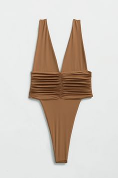 Our best-selling one-piece swimsuit! Equal parts sophisticated and sexy, the Echo One-Piece hugs your body and highlights your hips with a high-legged cut and minimal back coverage. The ruched side detail is met by moderate bust coverage and supportive shoulder straps. Super soft and super stretchy, this one-piece doubles as a bodysuit for an effortless beach-to-bar look. Just like an echo, you will want to repeat this purchase in every shade. Product description Minimal coverage front & back Do Ruched Stretch Backless Swimwear, High Cut Swimwear For Club And Summer, Summer Fitted Bodysuit With Ruched Back, Chic Backless Swimwear With Ruched Back, Stretch Ruched Bodysuit For Swimming, Stretch Backless Swimwear With Ruched Back, Backless Stretch Swimwear With Ruched Back, Fitted Ruched Backless Bodysuit, Party Swimwear With Ruched Sides