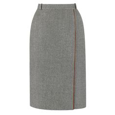 Vintage Gucci c.1970's gray wool wrap skirt. Four belt loops. Brown leather piping detail. Front wrap design with hook and bar and single button closures. Front and back waistline darts. Fully lined. Marked Fabric Content: "100% Wool". Unmarked Fabric Content: Trim: Genuine leather, Lining: Silk. Marked Size: "42". Measurements: Waist: 25" (narrowest point) Hip: 34" (measured 6" below waist) Total Length: 26" (measured on side) Wool Wrap Skirt, Corporate Dress, Pencil Skirt Outfits, Women White Blouse, Gucci Outfits, Mario Testino, Formal Skirt, Wool Pencil Skirt, Wool Wrap