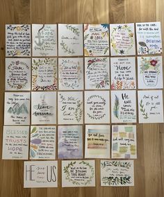 many cards are arranged on the floor with words written in different languages and colors,