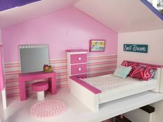 a doll's bedroom with pink and white furniture, bed, desk and mirror