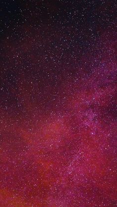 the night sky is filled with stars and bright pink hues, as well as dark purple