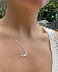 1.7 cm Recycled silver Crescent Moon pendant, stamped in homage to the beautiful moon. 44 cm Boston chain short necklace.  Handmade in Toronto, ON The silver is recycled (in an environmentally responsible way) from electronics, which contributes over 70% of toxicity to landfills, despite representing only 7% by volume. This highly regulated process takes place in Canada and the USA. This recycled silver is a higher grade than conventional sterling silver. It has a higher percentage of silver to copper, is nickel-free and contains germanium, a base metal that prevents oxidization.  The pieces are crafted to the highest standard, with all jump rings soldered shut, and all components work-hardened for hours.  For these reasons, you can confidently wear this piece every day: in the shower, whi Everyday Half Moon Phase Necklace, Minimalist Everyday Necklaces With Moon Phase, Minimalist Half Moon Necklace For Everyday, Sterling Silver Moon Charm Necklace For Everyday, Everyday Sterling Silver Charm Necklace With Moon Charm, Everyday Moon Shape Sterling Silver Charm Necklace, Silver Charm Necklaces With Moon Phase For Everyday, Minimalist Half Moon Sterling Silver Charm Necklace, Everyday Moon Shaped Sterling Silver Charm Necklace