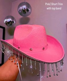 Great for any festivals, concerts, bachelorette parties, etc. Add this stylish great quality cowboy hat to your outfit! I am the owner of this small business and I hand make everything myself! I am a queer woman small business owner! Thank you for supporting me a head of time. If you have any questions, feel free to reach out!  Handmade Diamond trim cowboy hats. Come with either a band around the top or not. Also can come in a short Diamond trim or a long Diamond trim.  Come in colors: black, wh Karol G Cowboy Hat, Pink Space Cowgirl Hat, Diy Pink Cowboy Hat, Cowgirl Pink Hat, Taylor Cowboy Hat, Cowboy Party Hat, Sparkly Cowboy Outfit, Pink Sparkly Cowboy Hat, Glittery Cowboy Hat