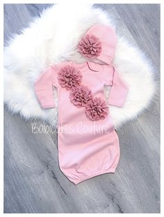 A Babicakes Couture Exclusive Original Design Couture Newborn Take Home Outfit! Luxuriously Soft Pink Couture Take Home Outfit ~ Gorgeous meets Comfort! { Gown } 100% Cotton Pink Sleeper gown adorned with satin eyelet lace flowers across bodice of gown. { Beanie } Matching Beanie Size Chart: 0-3mos fits up to 12lbs Your sweet little Babicakes will be stepping into the world fashionably stylish! This look is so elegant and one of a kind! Let Babicakes Couture create something magical and memorabl Pink Fitted Gown For Baptism, Fitted Pink Gown For Baptism, Pink Fitted Dress For Gift, Gift Fitted Pink Dress, Fitted Pink Dress For Gifts, Fitted Pink Dress As Gift, Pink Fitted Dress As A Gift, Newborn Take Home Outfit, Pink Couture