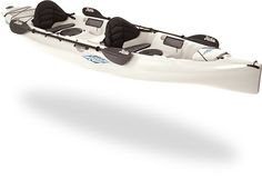 a white kayak with two seats on it