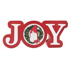 a red joy sign with a santa clause on it's face and wreath around the letter