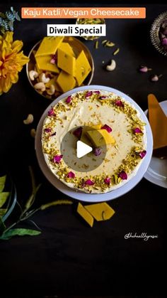 the cake is decorated with yellow and pink flowers on it's side, surrounded by other desserts