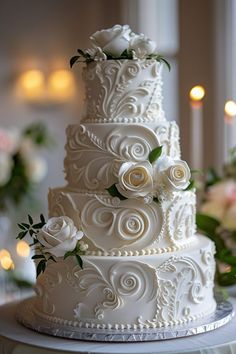 a three tiered wedding cake with white flowers