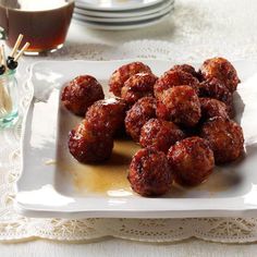 a plate full of meatballs on a table