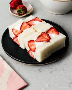 slices of cake on a plate with strawberries