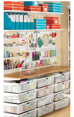 an organized office space with lots of colorful boxes and file folders on the shelves