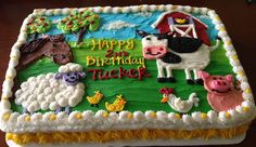 a birthday cake with farm animals on it