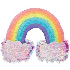 a rainbow shaped pinata with tassels on the sides and fringed edges