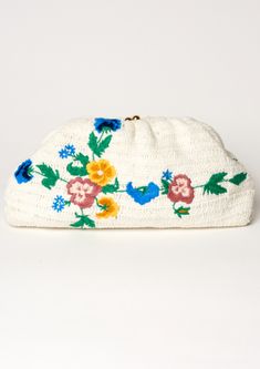 Add some floral flair to your summer wardrobe with the Vela Crochet Clutch. Perfect for beach days or nights out, this clutch features delicate embroidery and crochet details for a playful touch. Its optional gold chain allows for versatile styling options and the cotton stripe lining adds a pop of color. Don't miss out on this fun and functional accessory! Beige Bohemian Clutch For Spring, Handmade Bohemian Clutch For Spring, Handmade Bohemian Spring Clutch, Summer Multicolor Embroidered Clutch, Bohemian Rectangular Clutch For Spring, Beige Woven Clutch For Spring, Chic Woven Clutch For Spring, Spring Beige Woven Clutch, Spring Chic Crochet Clutch Bag