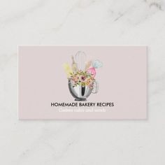 a pink business card with flowers in a cup on the front and words, homemade bakery recipes