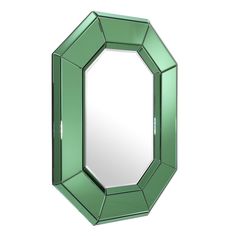 a green mirror sitting on top of a white wall