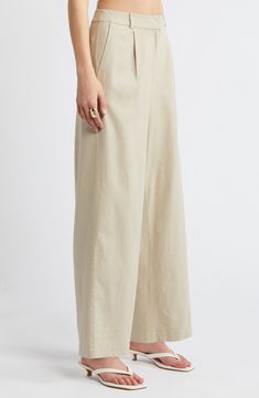 On-trend wide legs lend sophisticated drama to lightweight linen-blend pants designed with a crisp pleated front. 29" inseam; 20 1/2" leg opening; 12" front rise; 16" back rise (size 8) Zip fly with hook-and-bar closure Front slant pockets 53% linen, 44% rayon, 3% spandex Machine wash, tumble dry Imported Spring Workwear Wide Leg Pants In Flax, Flax Wide Leg Pants For Spring Workwear, Elegant Linen Wide Leg Pants With Elastic Waistband, Elegant Wide Leg Linen Pants With Elastic Waistband, Modern High-waisted Linen Wide Leg Pants, Spring Flax Wide Leg Pants For Work, Modern Wide Leg Linen Pants, Relaxed Fit Wide Leg Pants For Formal Summer Occasions, Relaxed Fit Wide Leg Pants For Summer Formal