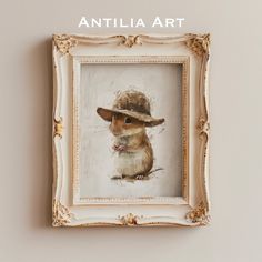 an animal with a hat on it's head is in a white frame hanging on the wall