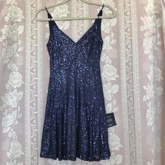 Lulus Blue Sequin Party Dress Nwt Gorgeous Little Party Dress By Lulu‘s Is Brand New. Covered In Navy Sequins With Flare Skirt. V-Neck Front And Back. Stretchy Spaghetti Straps. Dress Has Stretch. * Tag Size Xs * Waist 11-12” * Pit To Pit 14” * Length (Pit To Hem)23” #Lulus #Navyblue #Dress #Mini #Sequins Spaghetti Straps Dress, Dresses Lulus, Straps Dress, Sequin Party, Lulus Dresses, Sequin Party Dress, Lulu Dresses, Dress Mini, Flare Skirt